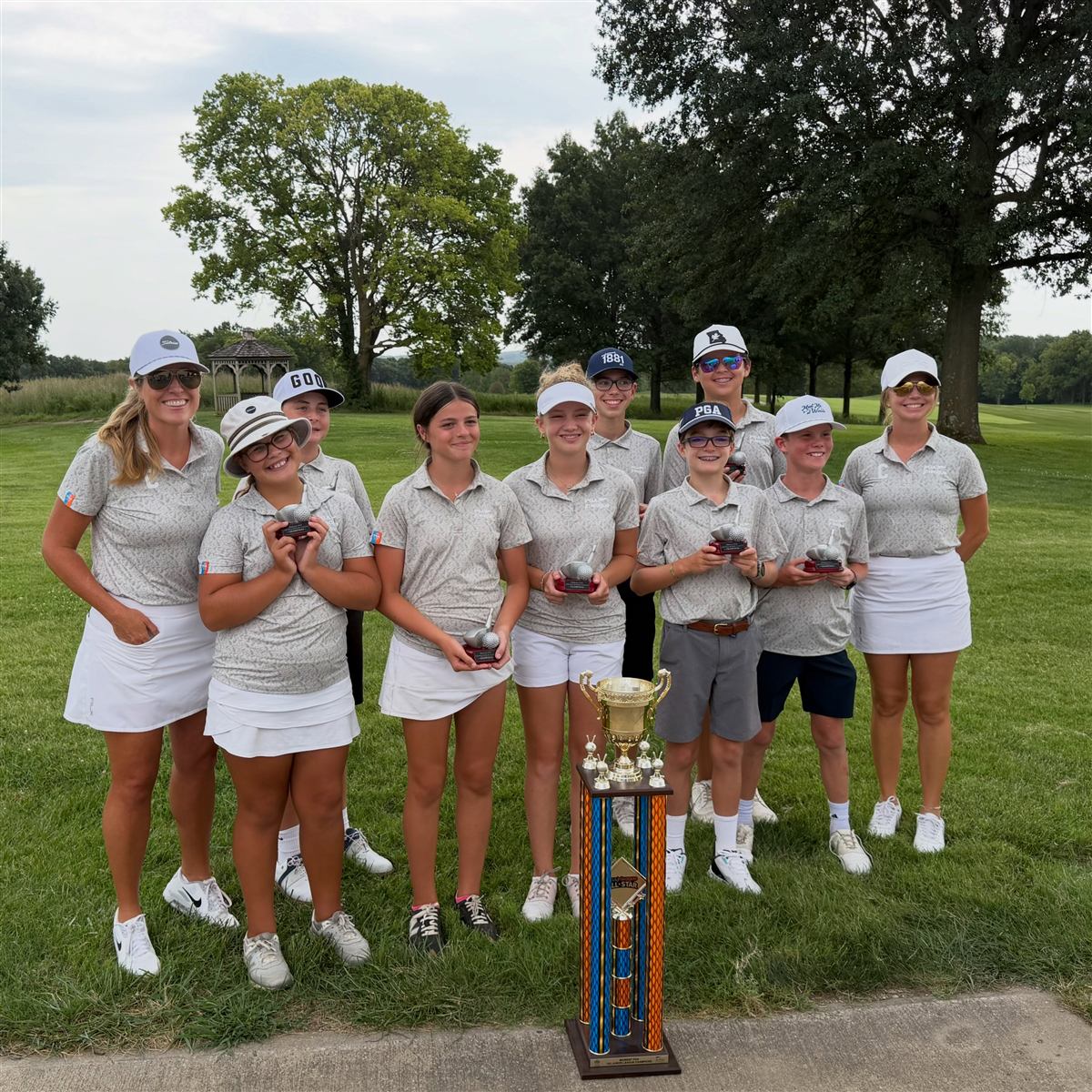 Youth development golfers practicing together
